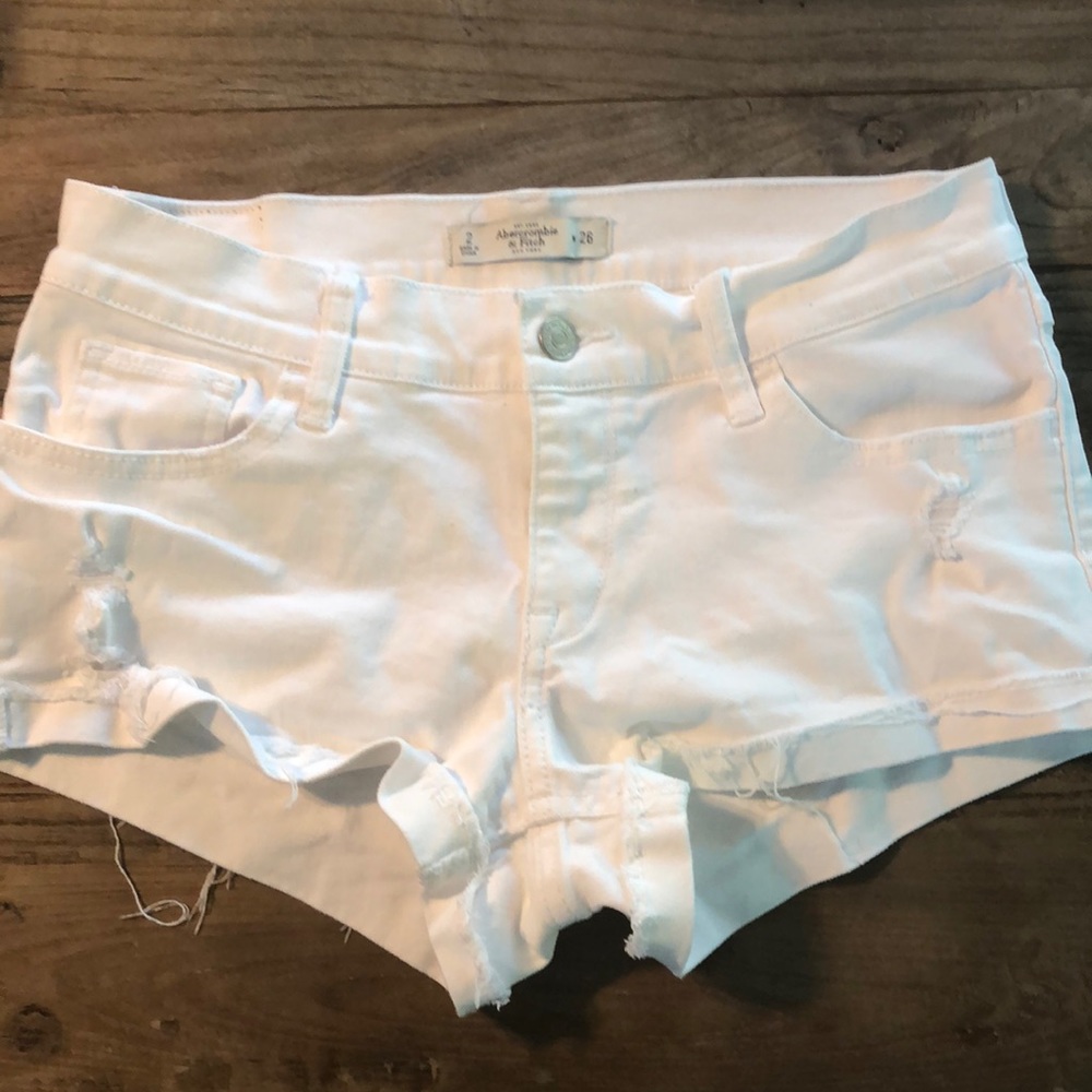White distressed shorts